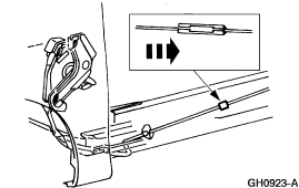 2007 Ford Mustang - Service illustration of a cable routing and retaining clip with a directional arrow and a magnified detail inset.