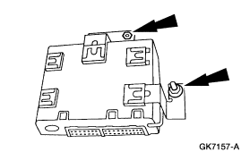 2007 Ford Mustang - Service manual line drawing of an electronic control module with arrows indicating mounting/fastener points.