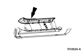 2007 Ford Mustang - Service manual line drawing of a body panel or bracket with an arrow indicating a service point.
