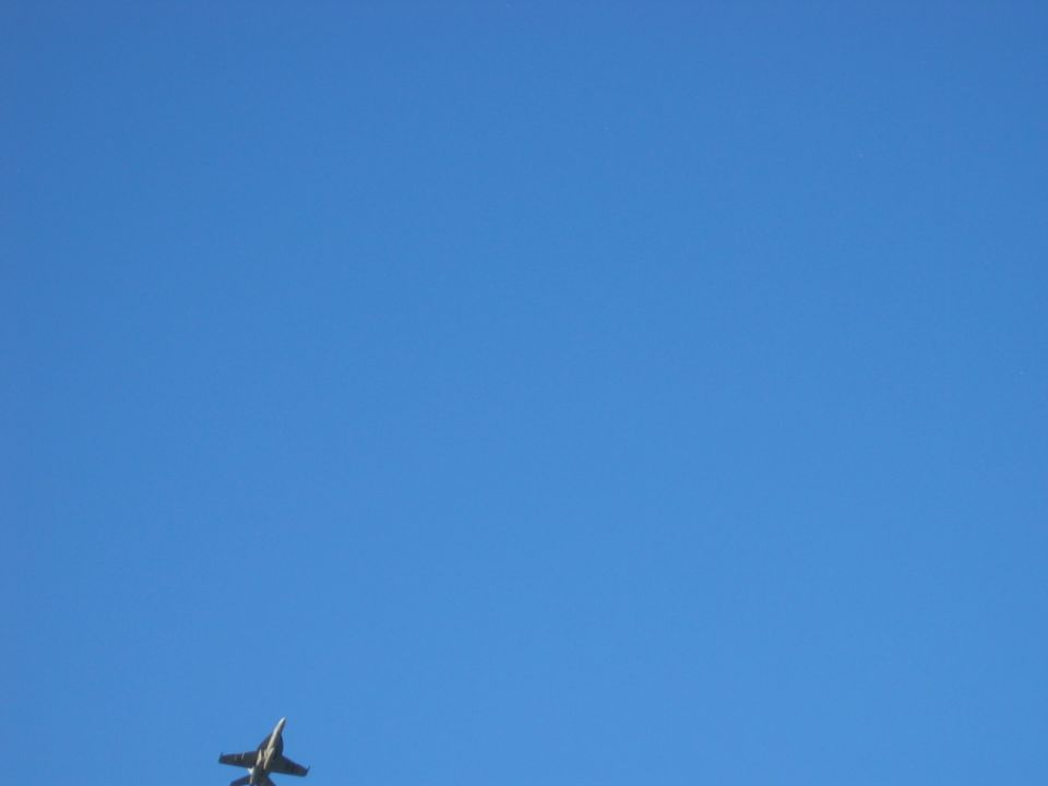 Jet airplane flying in a clear blue sky
