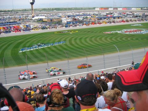1985 Ford LTD Crown Victoria - Race cars compete on the Chicagoland Speedway track during a NASCAR event.