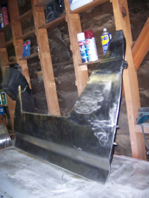 1991 Ford Bronco - Car door panel in a garage, possibly undergoing restoration or modification.