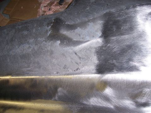 1991 Ford Bronco - Bare metal panel with visible scratches and some discoloration, likely from a repair or restoration process.