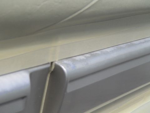 1993 Ford C-350 (Centurion Conversions) - A close-up view of the interior trim of a vehicle, showing a gap between two panels.