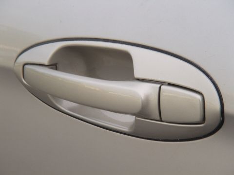 1993 Ford C-350 (Centurion Conversions) - Close-up of a vehicle's door handle.