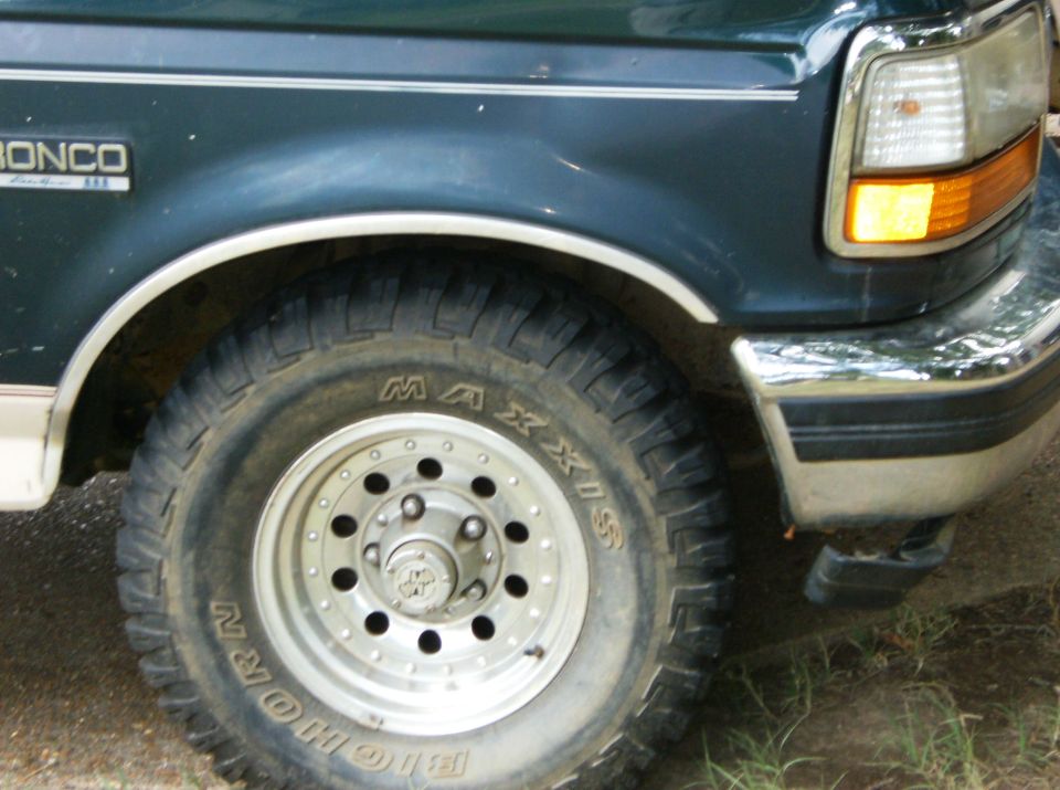 1993 Ford Bronco front fender, wheel, and bumper detail. Maxxis Big Horn tire