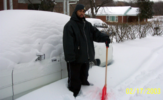 1991 Ford Crown Victoria LTD - Clearing snow from a vehicle during a winter storm.