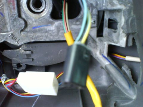2003 Ford Crown Victoria - Wiring harness components are visible in this close-up interior shot of a vehicle.