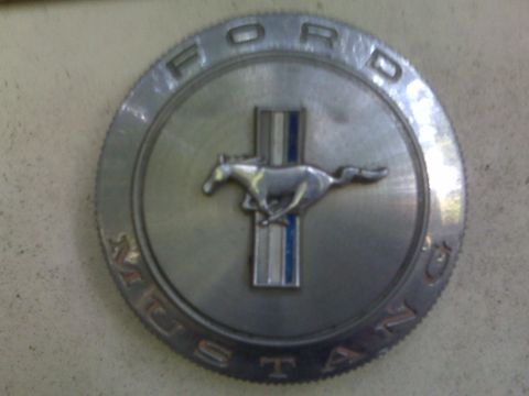 1966 Ford Mustang - This emblem clearly identifies the vehicle as a 1966 Ford Mustang.