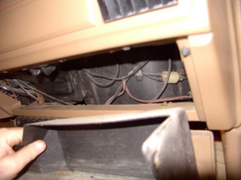 1986 Ford Bronco - Remove inner glovebox liner.