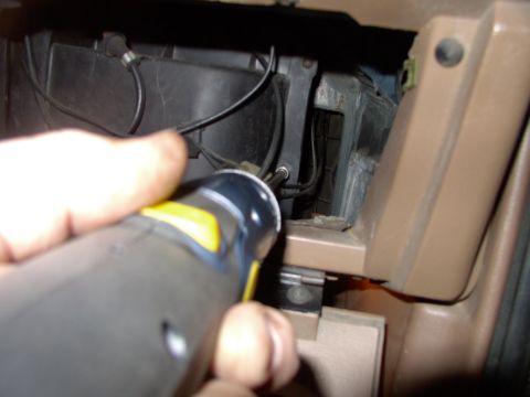 1986 Ford Bronco - Ain't no need to remove glove box door. Just get after the half dozen 5/16" bolts. I'm using a power screwdriver in the pic.