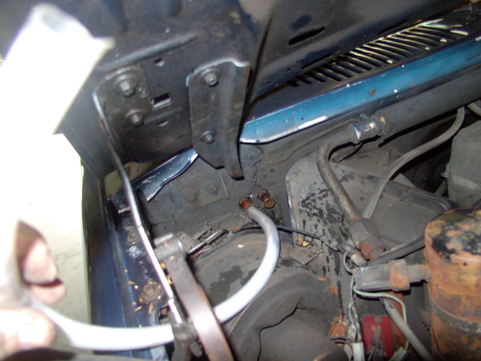 I like to slip a clear hose over one of the nipples and blow the coolant out of the core, into a container (saves the rug).