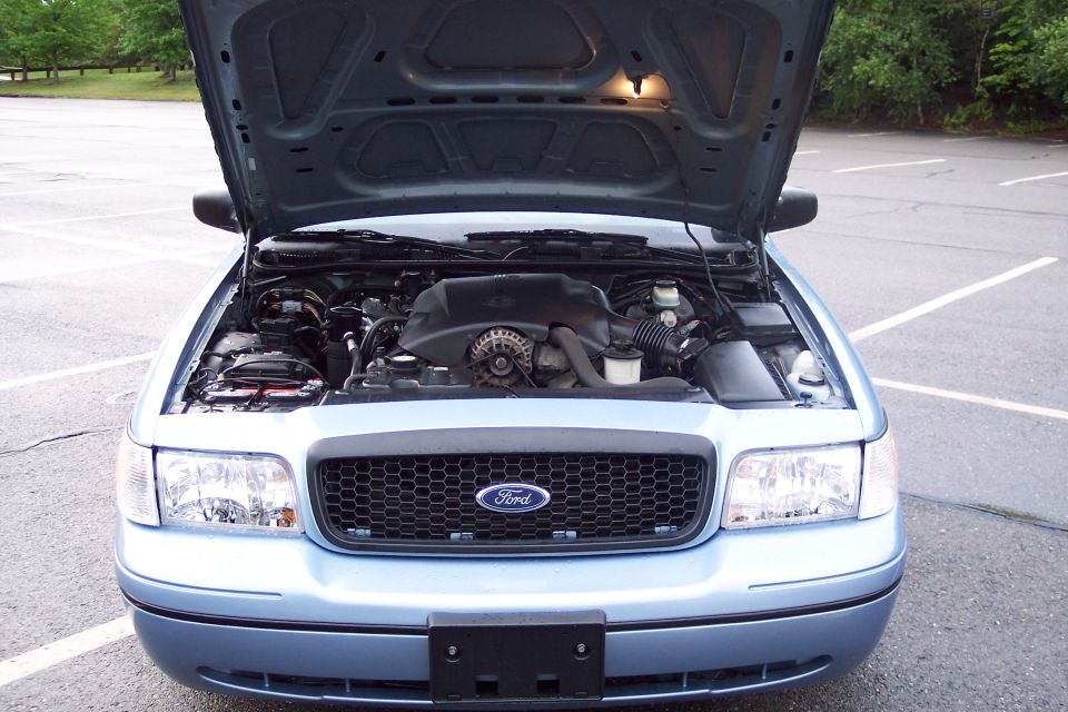2001 Ford Crown Victoria front view, hood open showing engine