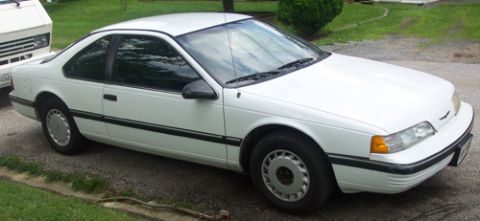 1991 Ford Crown Victoria LTD - White coupe with black trim parked on a gravel driveway.
