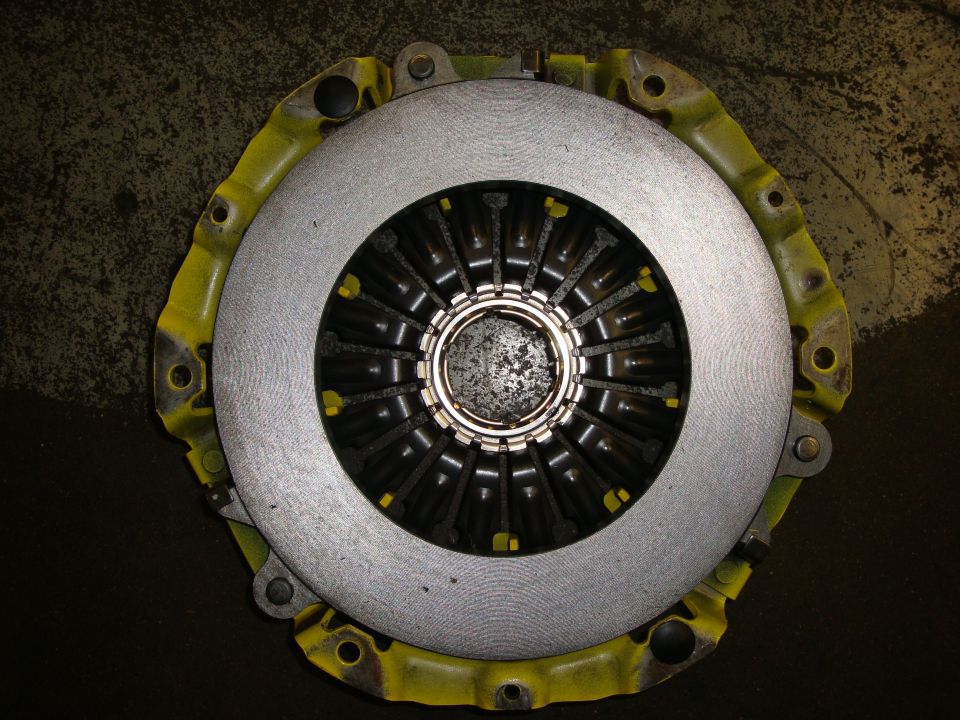 Clutch assembly with yellow housing and silver friction disc