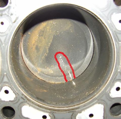 2007 Ford Mustang - Photograph of an engine cylinder bore with a red annotation circling a scoring mark.