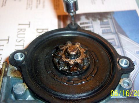1991 Ford LTD Crown Victoria - Remove screw holding cover to motor and remove the cover