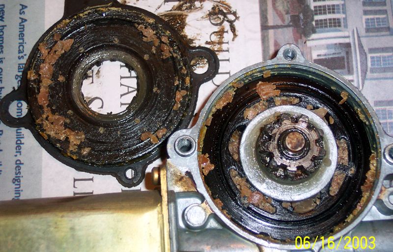 Remove all fragments of destroyed bushings from motor. Pry off c clip and remove gear assembly