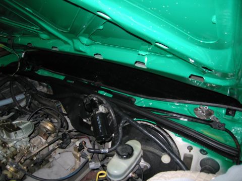 1991 Ford LTD Crown Victoria - Photo of a sedan engine bay, not a technical document.