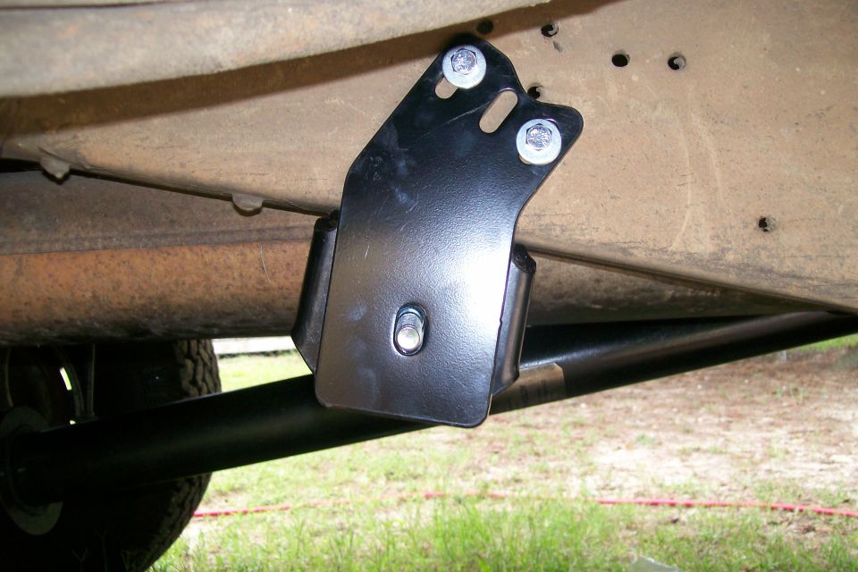 The back two brackets just bolt up.  The bottom one first, then the side one, and the two over-lap.