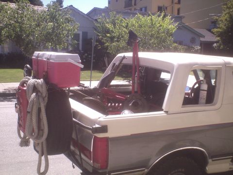 1991 Ford Bronco - This 1980s Ford Bronco is seen from the rear, with a red cooler placed in the cargo bed.