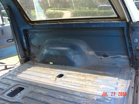 1989 Ford Bronco - Rear passenger side. There is a big rust area in front of the rear wheel that will need to be fixed.