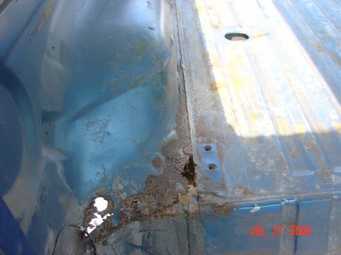 1989 Ford Bronco - Rear passenger side rust holes. This is in front of the rear tire.