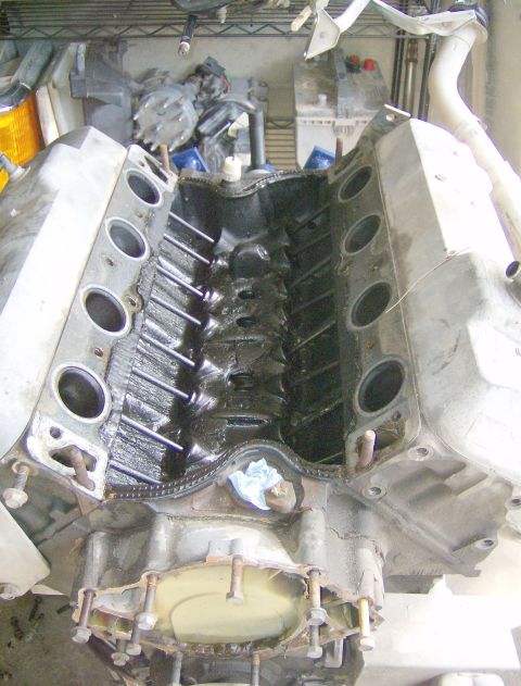 1990 Ford Bronco - Intake off, assessing the sludge in the oil valley.