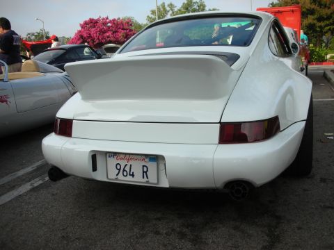 1998 Ford Crown Victoria - Photograph of the rear of a white Porsche 911 (964) with a whale-tail spoiler and California plate.