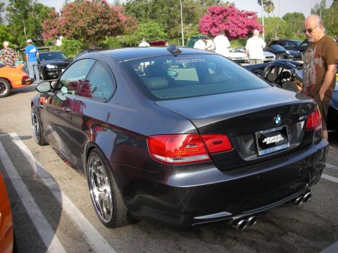 1998 Ford Crown Victoria - Photograph of a dark gray BMW E92 M3 coupe at an outdoor car meet.