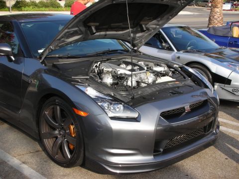 1998 Ford Crown Victoria - Photograph of a gray Nissan GT-R with its hood open exposing the engine, not a technical document.