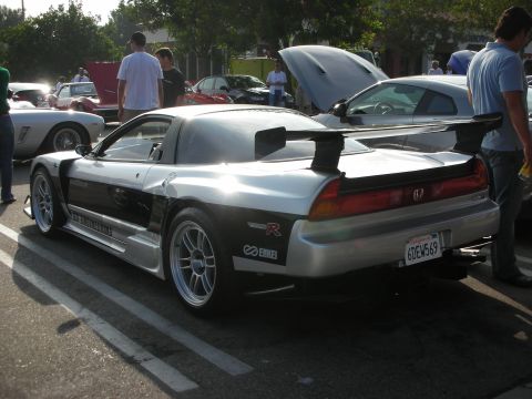 1998 Ford Crown Victoria - Photograph of a modified silver-and-black Honda NSX from the rear at a car meet, not a technical document.