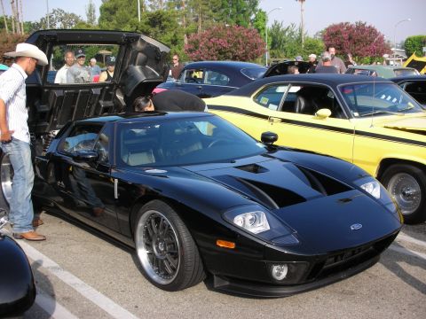 1998 Ford Crown Victoria - Photograph of a black Ford GT supercar parked at an outdoor car meet, not a technical document.
