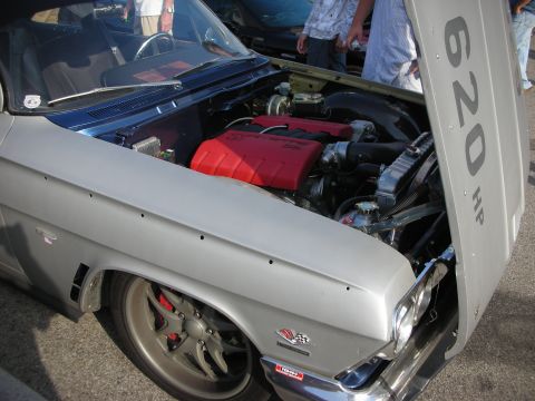 1998 Ford Crown Victoria - Photograph of a custom car's engine bay with a 620 HP hood marking, not a technical document.