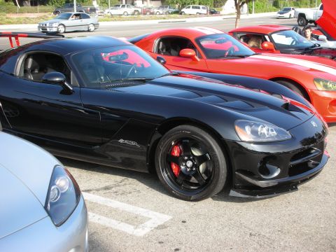 1998 Ford Crown Victoria - Photograph of a black Dodge Viper coupe at a car meet, not a technical document.