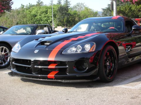1998 Ford Crown Victoria - Photograph of the front of a black Dodge Viper ACR with orange stripes, not a technical document.