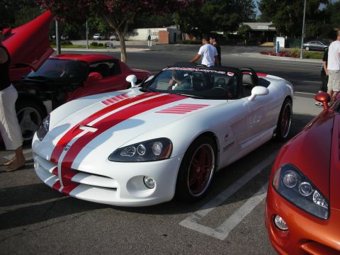 1998 Ford Crown Victoria - Photograph of a white Dodge Viper roadster with red stripes at a car meet, not a technical document.