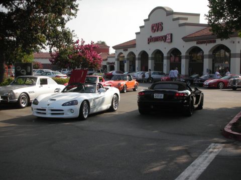 1998 Ford Crown Victoria - Photograph of Dodge Vipers in a parking lot outside a CVS pharmacy at a car meet, not a technical document.