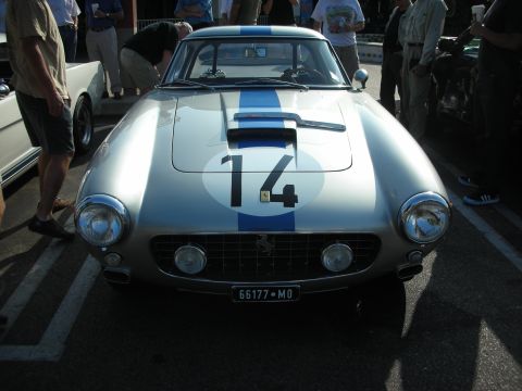 1998 Ford Crown Victoria - Photograph of a silver vintage Ferrari race car with a blue stripe and racing number 14, not a technical document.
