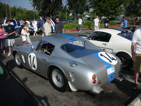 1998 Ford Crown Victoria - Photograph of the rear of a silver vintage Ferrari race car at a car show, not a technical document.