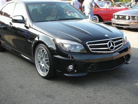 1998 Ford Crown Victoria - Photograph of a black Mercedes-Benz AMG sedan at an outdoor car gathering, not a technical document.