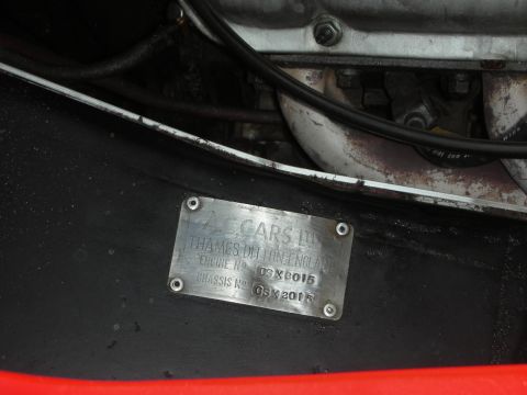 1998 Ford Crown Victoria - AC Cars data plate riveted to a body panel listing the engine number and chassis number for the vehicle.