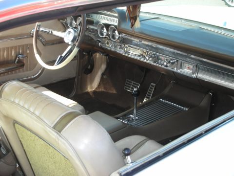 1998 Ford Crown Victoria - Photograph of the dashboard, steering wheel and front seats of a vintage car interior, not a technical document.
