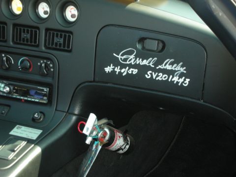 1998 Ford Crown Victoria - Photograph of a Dodge Viper dashboard autographed by Carroll Shelby, not a technical document.