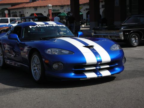 1998 Ford Crown Victoria - Photograph of a blue Dodge Viper with white stripes at a car show, not a technical document.