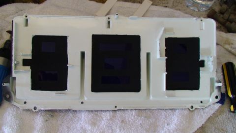 1979 Ford Bronco - This is a white gauge cluster housing with three black rectangular openings for gauges.