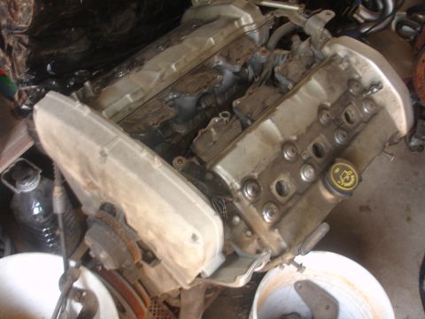 1993 Ford Taurus - Engine component with a yellow cap bearing the Ford logo is visible.