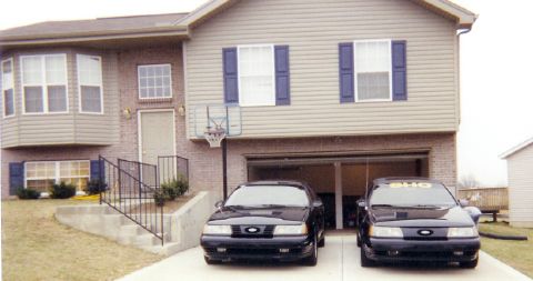 1991 Ford Taurus - Basking in the sun,in front of the homefront.