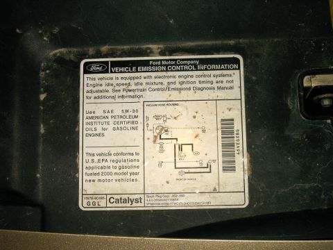 2000 Mercury Grand Marquis - This sticker provides vehicle emission control information, including oil type and vacuum hose routing.