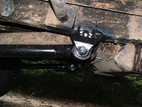 1996 Ford Bronco - Close-up view of the undercarriage, focusing on the suspension and frame components.